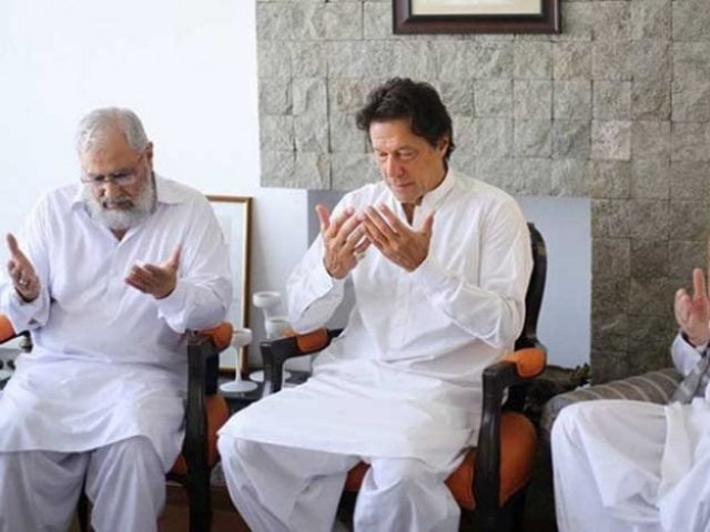 pti chief imran khan with the family of martyred major ali salman in lahore photo express pti chief imran khan with the family of martyred major ali salman in lahore photo express