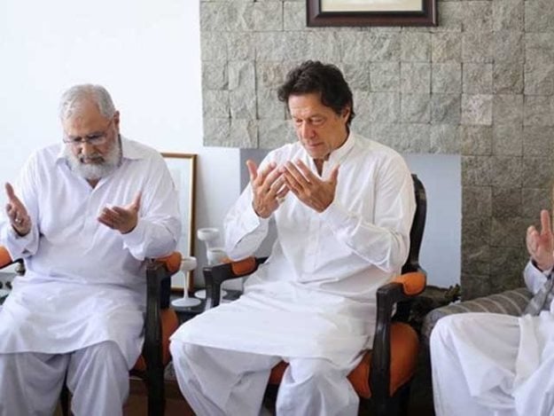 pti chief imran khan with the family of martyred major ali salman in lahore photo express