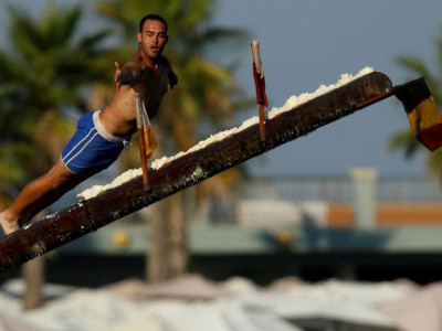 at maltese festival climbing the greasy pole is part of the fun at maltese festival climbing the greasy pole is part of the fun