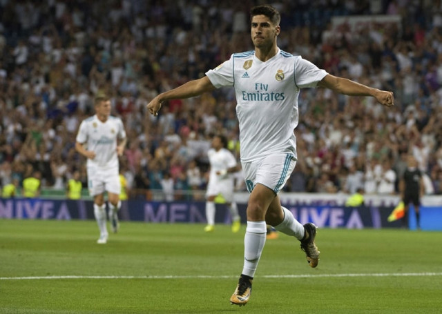 real madrid 039 s midfielder marco asensio celebrates after scoring during the spanish league football match real madrid cf vs valencia cf at the santiago bernabeu stadium in madrid on august 27 2017 photo afp real madrid 039 s midfielder marco asensio celebrates after scoring during the spanish league football match real madrid cf vs valencia cf at the santiago bernabeu stadium in madrid on august 27 2017 photo afp