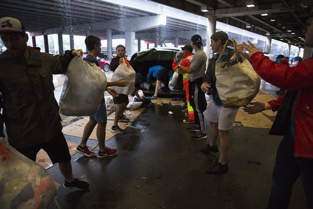 volunteers unload donated items at the george brown convention center which has been turned into a shelter run by the american red cross to house victims of the high water from hurricane harvey on august 28 2017 in houston texas photo afp volunteers unload donated items at the george brown convention center which has been turned into a shelter run by the american red cross to house victims of the high water from hurricane harvey on august 28 2017 in houston texas photo afp
