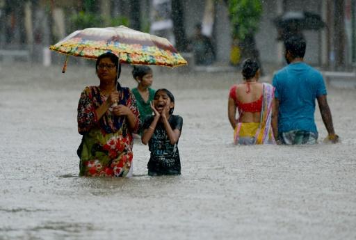 three killed as floods swamp india 039 s financial hub photo afp