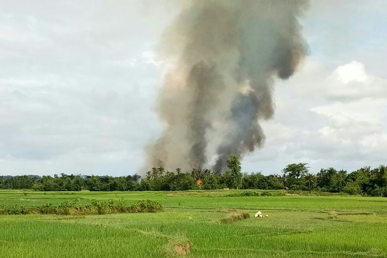 smoke rises from what is believed to be a burning village near maungdaw in myanmar 039 s rakhine state photo afp