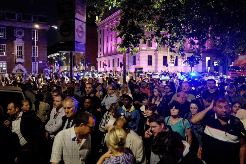 commuters are seen outside euston station after police evacuated the area following a security alert in london britain august 29 2017 photo reuters