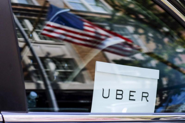 an uber sign is seen in a car in new york u s june 30 2015 photo reuters an uber sign is seen in a car in new york u s june 30 2015 photo reuters
