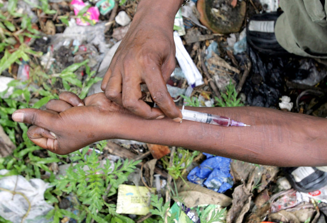 an injecting drug user injects himself with fortwin on a roadside photo reuters an injecting drug user injects himself with fortwin on a roadside photo reuters
