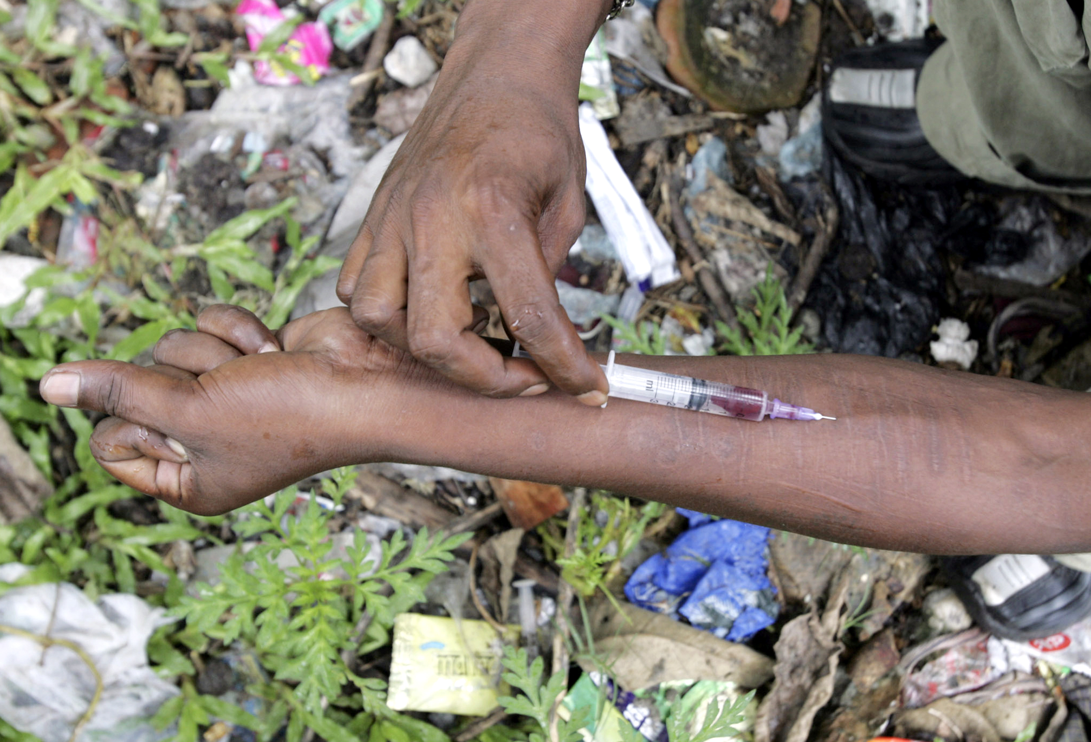 an injecting drug user injects himself with fortwin on a roadside photo reuters