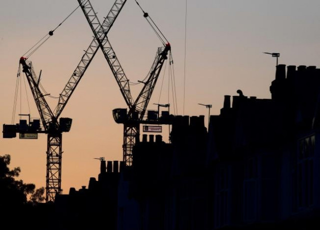 construction cranes are seen on a residential building project photo reuters construction cranes are seen on a residential building project photo reuters
