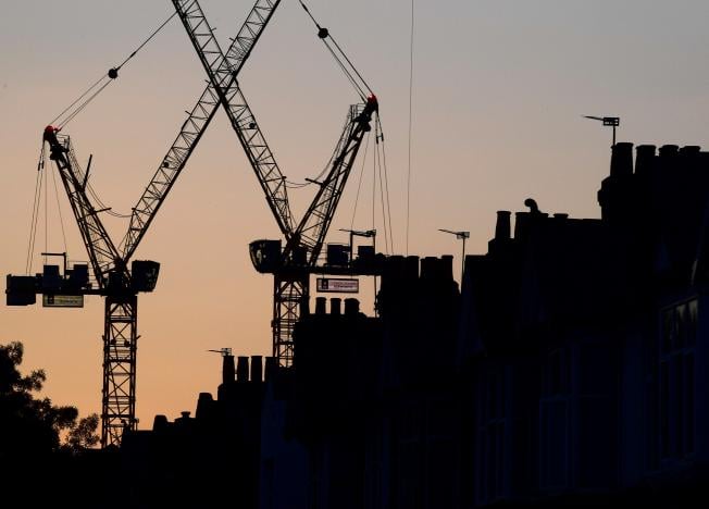 construction cranes are seen on a residential building project photo reuters