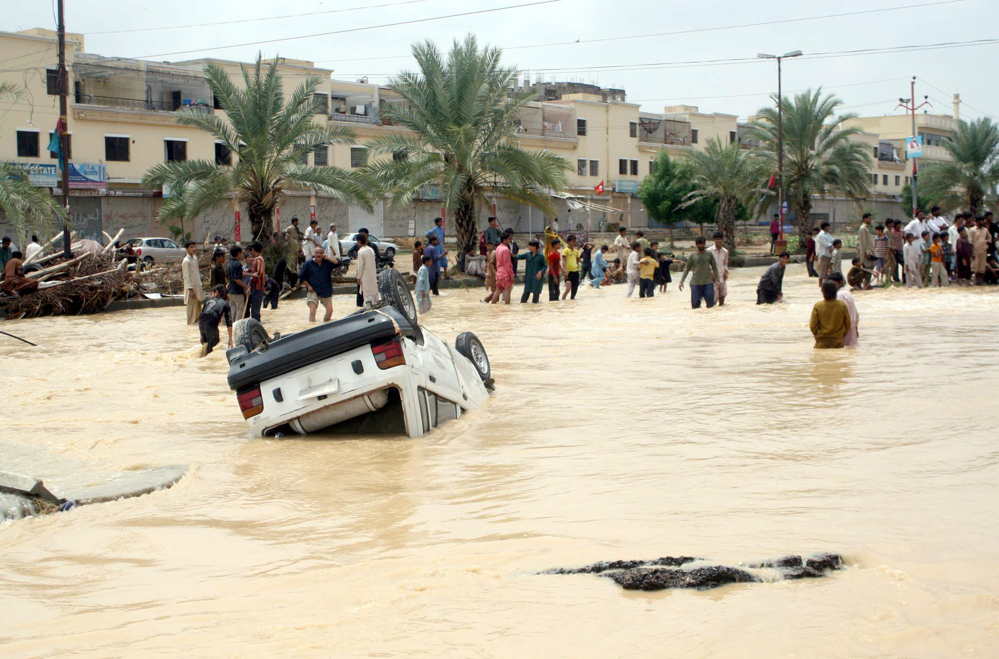 a lopsided car floats in water neear saadi town following from a breached water channel in gadap photo ppi
