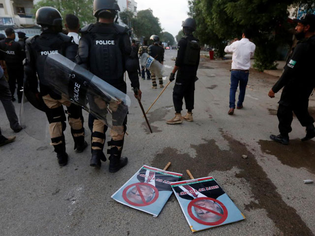 placards are seen left after police dispersed student protesters during a rally in karachi against us president donald trump on august 27 2017 photo reuters