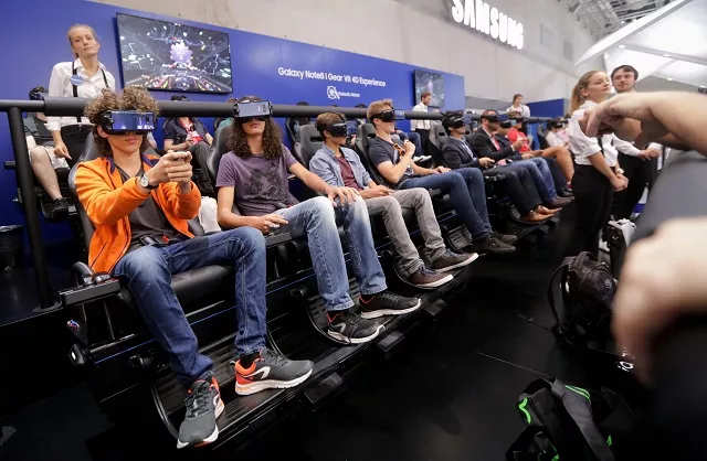 visitors try out vr glasses and their appliances at the booth of samsung at the ifa consumer electronics fair in berlin on september 1 2017 the fair is open for the public from september 1 to 6 2017 photo afp visitors try out vr glasses and their appliances at the booth of samsung at the ifa consumer electronics fair in berlin on september 1 2017 the fair is open for the public from september 1 to 6 2017 photo afp