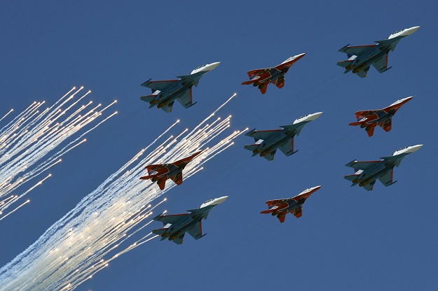 a mixed flight group of strizhi swifts on mig 29 aircrafts and russkie vityazi russian knights on su 30 aircrafts fly over red square during the victory day military parade general rehearsal in moscow on may 7 2017 photo afp