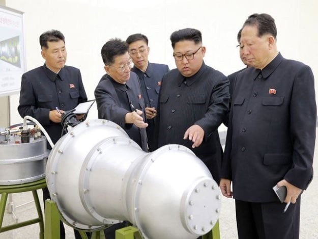 north korea released images of leader kim jong un at the nuclear weapons institute inspecting what it said was a miniaturised h bomb that could be fitted onto an intercontinental ballistic missile photo afp