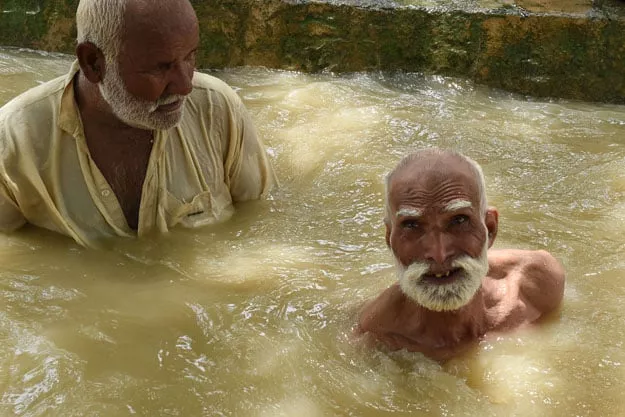 in this photograph taken on august 11 2017 pakistani men cool themselves off in a stream during a hot day in sibi in balochistan photo afp in this photograph taken on august 11 2017 pakistani men cool themselves off in a stream during a hot day in sibi in balochistan photo afp