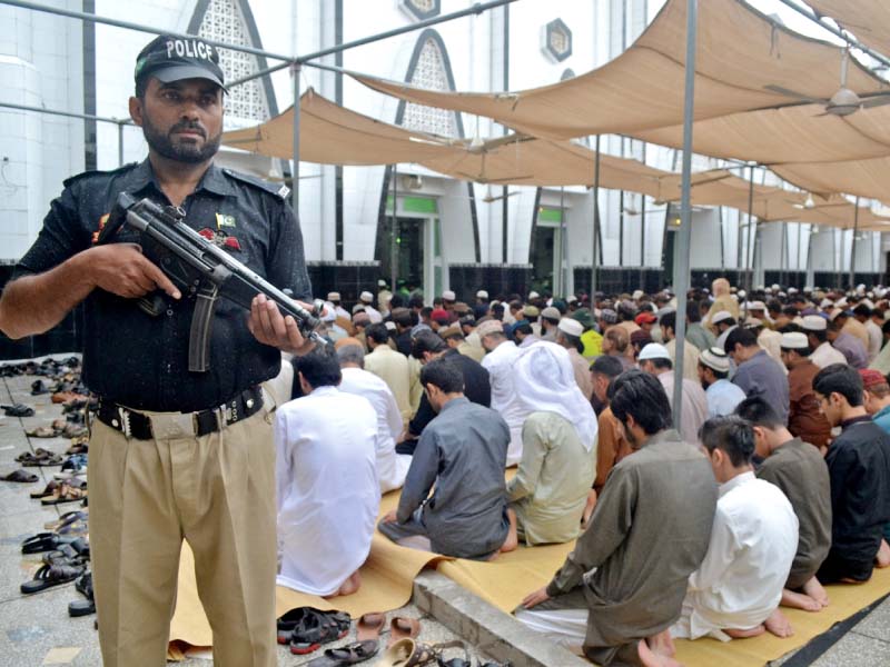 a policeman stands guard during eid prayers at satellite town mosque in rawalpindi photo agha mehroz express