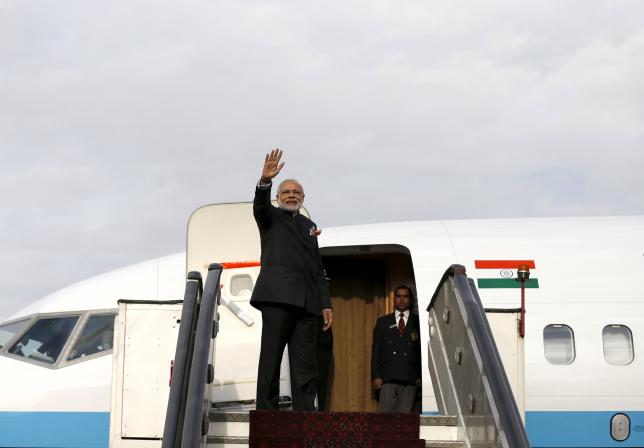 india 039 s prime minister narendra modi waves as he boards a plane photo afp