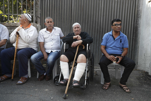 palestinian ayoub shamasneh 84 reacts as israeli policemen evict him from his family home in which they lived for over half a century photo afp