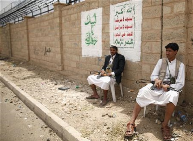 members of the shi 039 ite rebel al houthi group sit while guarding a group meeting in sanaa september 16 2012 photo reuters khaled abdullah