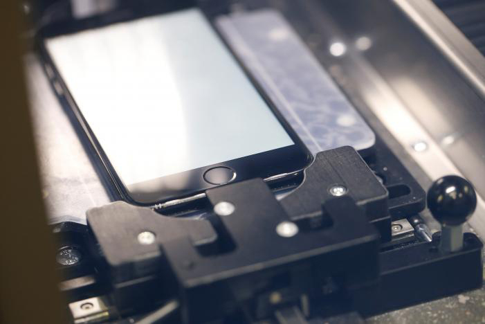 a repaired apple iphone is seen inside the proprietary horizon machine fixture as it undergoes a repair procedure at apples display repair laboratory in sunnyvale california us may 19 2017 photo reuters