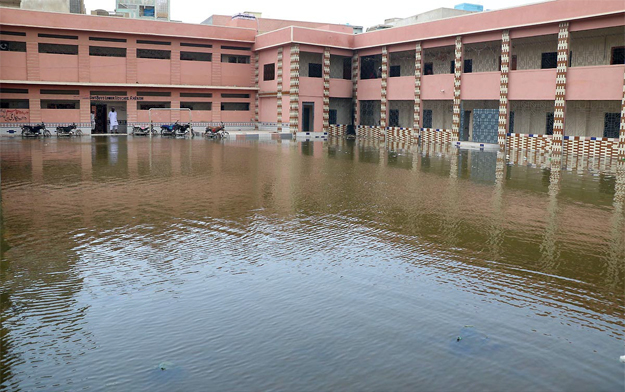 water remains accumulated at jamia muhammadi school in lyari contrary to the local government minister 039 s claim that rainwater had been drained in the area photo online