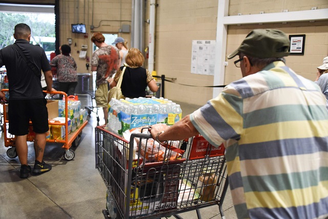 shoppers at costco buying essentials in preparation for hurricane irma on september 5 2017 in north miami the monster hurricane coming on the heels of harvey which struck texas and louisiana late last month is expected to hit a string of caribbean islands including guadeloupe late tuesday before heading to haiti and florida the miami based national hurricane center said irma had strengthened to the most powerful category five packing winds of 180 miles 280 kilometers per hour photo afp