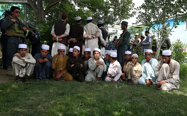 in this photograph taken on july 15 2017 afghan children released from captivity are presented to the media at the police headquarters in ghazni the rescue this summer of dozens of afghan youths destined for pakistan religious schools to be trained as taliban fighters has bolstered claims that insurgents are increasingly recruiting children to reinforce their ranks photo afp in this photograph taken on july 15 2017 afghan children released from captivity are presented to the media at the police headquarters in ghazni the rescue this summer of dozens of afghan youths destined for pakistan religious schools to be trained as taliban fighters has bolstered claims that insurgents are increasingly recruiting children to reinforce their ranks photo afp