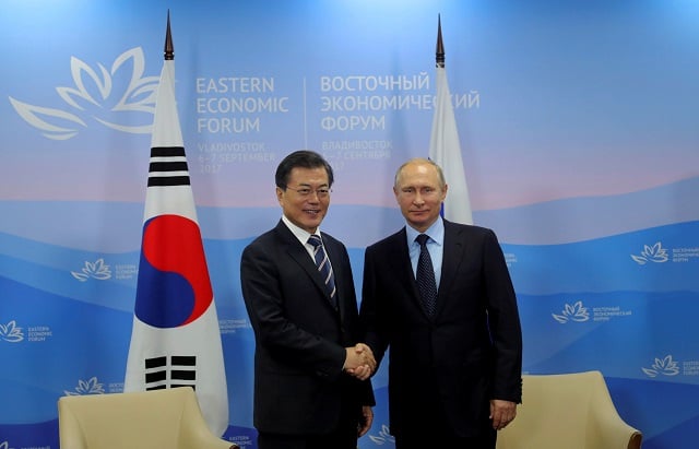 russian president vladimir putin and his south korean counterpart moon jae in shake hands during a meeting at the eastern economic forum in vladivostok russia september 6 2017 photo reuters