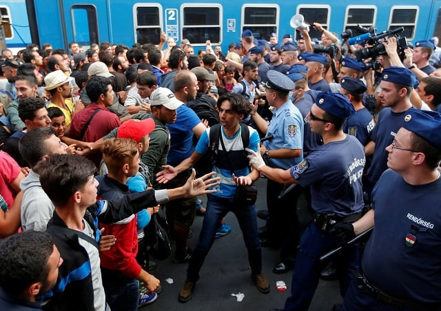 migrants face hungarian police in the main eastern railway station in budapest hungary september 1 2015 photo reuters laszlo balogh file migrants face hungarian police in the main eastern railway station in budapest hungary september 1 2015 photo reuters laszlo balogh file