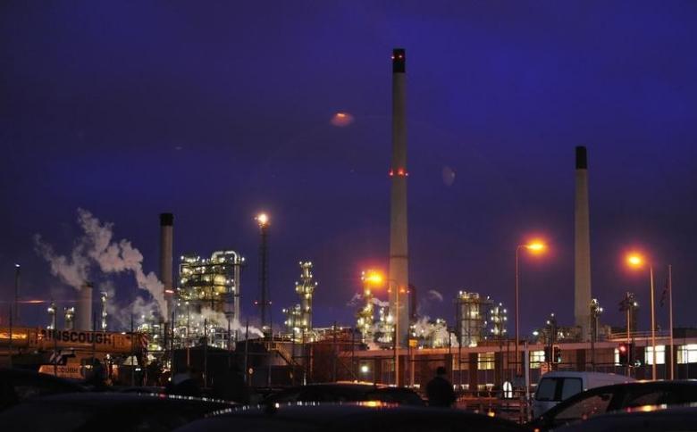 lights shine within an oil refinery photo reuters