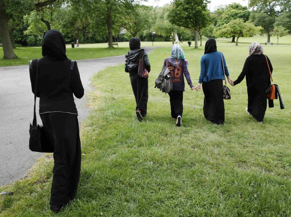 muslim women walk in the park after finishing a gcse exam near their school in hackney east london photo reuters