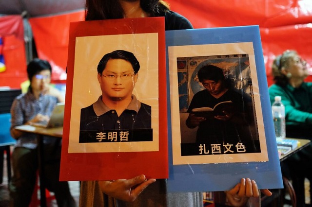 pictures of lee ming cheh left a rights advocate from taiwan and tashi wangchuk an education advocate from tibet during a commemoration last month in taiwan of the 1989 pro democracy crackdown in china photo afp