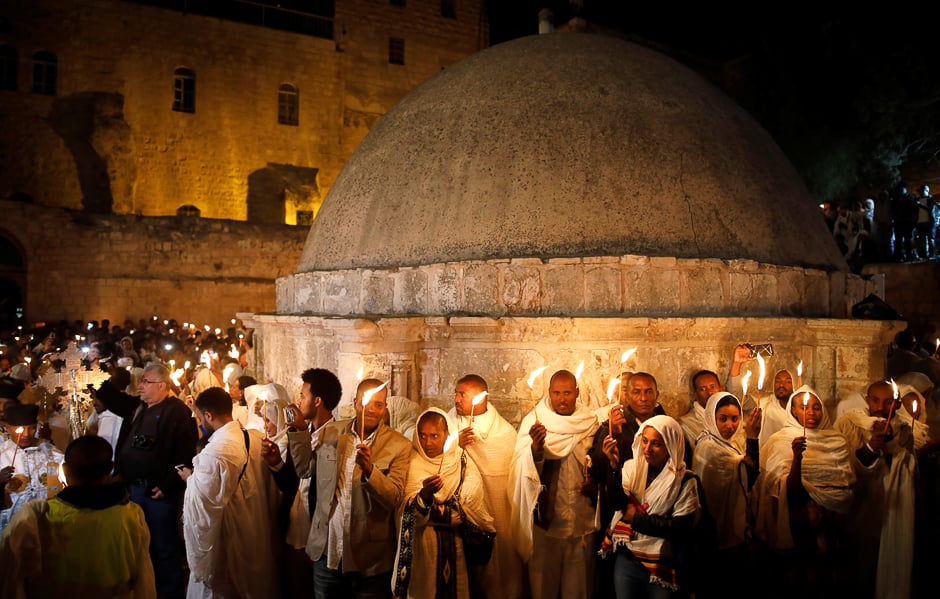 Ethiopian Orthodox worshippers hold candles during the Holy Fire ceremony at the Ethiopian section of the Church of the Holy Sepulchre in Jerusalem's Old City. PHOTO: REUTERS