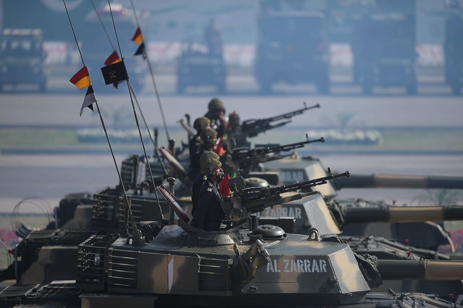 Tank crews steer their vehicles during a Pakistan Day military parade in Islamabad. PHOTO: AFP