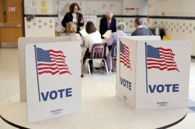 voters receive their ballot to vote in the super tuesday election at sleepy hollow elementary school in falls church virginia march 1 2016 photo reuters voters receive their ballot to vote in the super tuesday election at sleepy hollow elementary school in falls church virginia march 1 2016 photo reuters