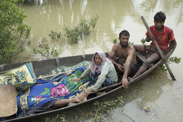 this file photo taken on september 6 2017 shows the bodies of rohingya refugees being brought to the shore of the naf river on a boat by fellow rohingyas in ukhiya photo afp