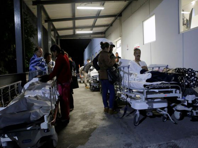 patients and family members are seen outside the institute for social security and services for state workers issste after an earthquake struck off the southern coast of mexico late on thursday in puebla mexico september 8 2017 photo reuters