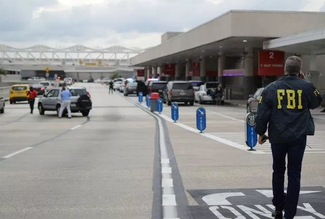 law enforcement walk outside a terminal after a shooter opened fire at a baggage carousel at fort lauderdale hollywood international airport in florida january 6 2017 photo reuters zachary fagenson law enforcement walk outside a terminal after a shooter opened fire at a baggage carousel at fort lauderdale hollywood international airport in florida january 6 2017 photo reuters zachary fagenson