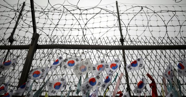 south korean national flags hang on a barbed wire fence near the demilitarized zone separating the two koreas in paju south korea august 14 2017 photo reuters