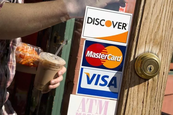 a coffee shop displays signs for visa mastercard and discover in washington may 1 2013 photo reuters a coffee shop displays signs for visa mastercard and discover in washington may 1 2013 photo reuters