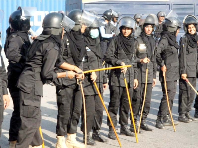a contingent of women police in riot gear looks on anti myanmar protesters gather near the red zone photo zafar aslam express a contingent of women police in riot gear looks on anti myanmar protesters gather near the red zone photo zafar aslam express