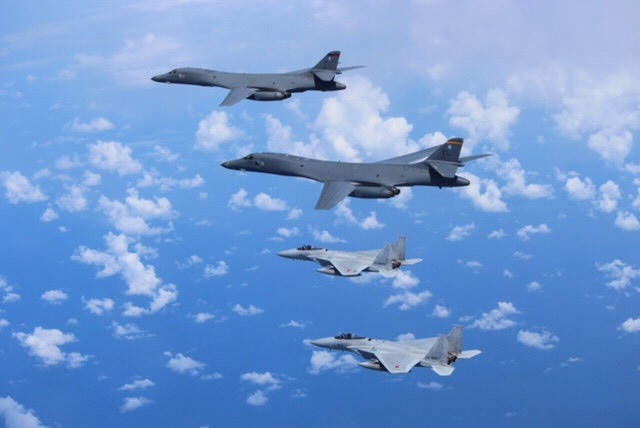 refile   correcting position japan 039 s self defense forces f 15 fighter jets bottom conduct an air exercise with u s air force b 1b lancer bombers flying from andersen air force base guam in the skies above the east china sea japan in this photo released by the air staff office of the defense ministry of japan september 9 2017 air staff office of the defense ministry of japan photo reuters