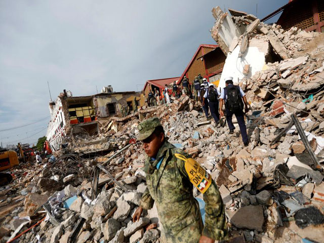 soldiers work to remove the debris of a house destroyed in an earthquake that struck off the southern coast of mexico late on thursday in juchitan mexico september 8 2017 photo reuters