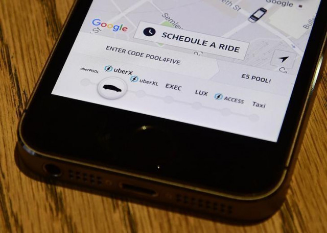 a photo illustration shows the uber app logo displayed on a mobile telephone as it is held up for a posed photograph in central london britain october 28 2016 photo reuters a photo illustration shows the uber app logo displayed on a mobile telephone as it is held up for a posed photograph in central london britain october 28 2016 photo reuters