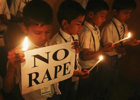 students hold candles as they pray during a candlelight vigil for a gang rape victim who was assaulted in new delhi photo reuters file