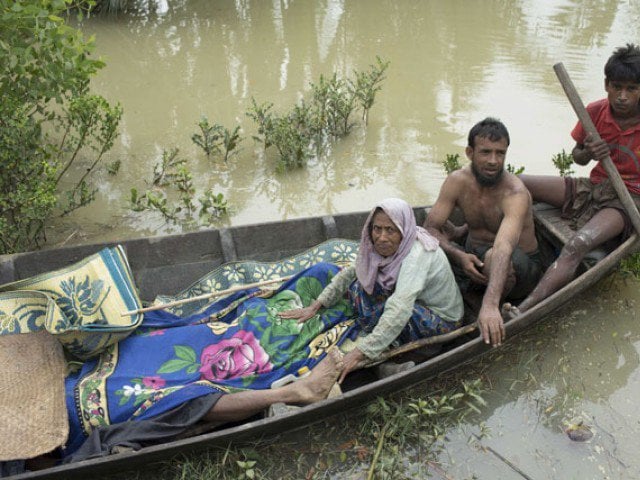 this file photo taken on september 6 2017 shows the bodies of rohingya refugees being brought to the shore of the naf river on a boat by fellow rohingyas in ukhiya photo afp