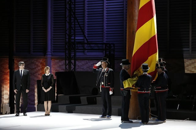 president of the catalan regional government carles puigdemont l and president of the catalan parliament carme forcadell 2l watch 039 mossos d 039 esquadra 039 catalan regional police honour guard raising a catalan flag during an institutional ceremony in barcelona on september 10 2017 on the eve of the national day of catalonia quot diada quot pro independence protesters are due to come out in force in the streets of barcelona on september 11 2017 for catalonia 039 s national day three weeks ahead of a controversial secession referendum banned by spain the quot diada quot holiday which commemorates the fall of barcelona to spain in 1714 has been used by separatists in recent years to press for an independent state photo afp president of the catalan regional government carles puigdemont l and president of the catalan parliament carme forcadell 2l watch 039 mossos d 039 esquadra 039 catalan regional police honour guard raising a catalan flag during an institutional ceremony in barcelona on september 10 2017 on the eve of the national day of catalonia quot diada quot pro independence protesters are due to come out in force in the streets of barcelona on september 11 2017 for catalonia 039 s national day three weeks ahead of a controversial secession referendum banned by spain the quot diada quot holiday which commemorates the fall of barcelona to spain in 1714 has been used by separatists in recent years to press for an independent state photo afp