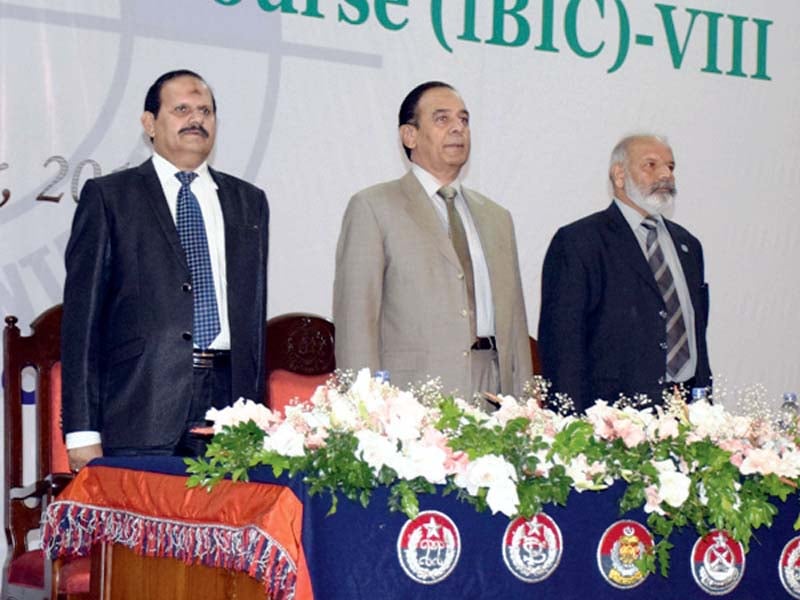 nab chairman qamar zaman chaudhry rises for the national anthem photo express