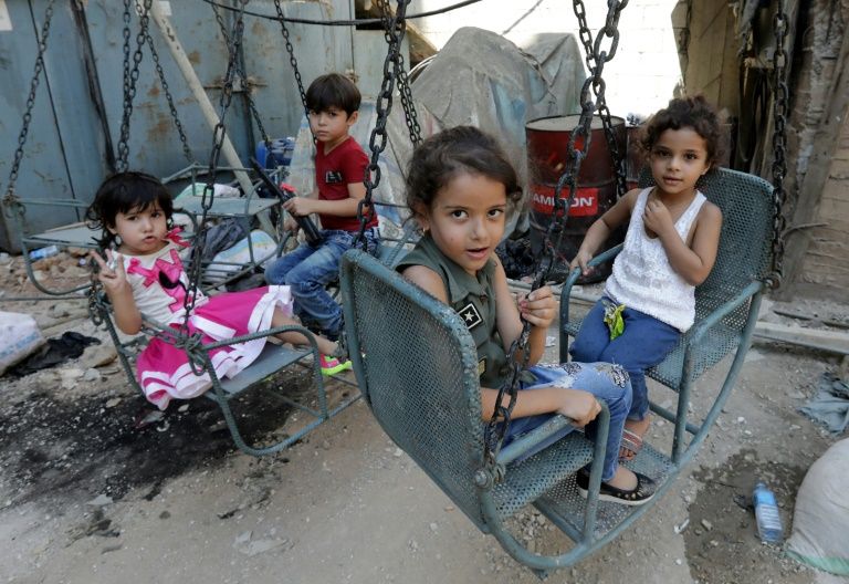 syrian refugee children play on a street in the palestinian shatila refugee camp on the southern outskirts of the lebanese capital beirut photo afp