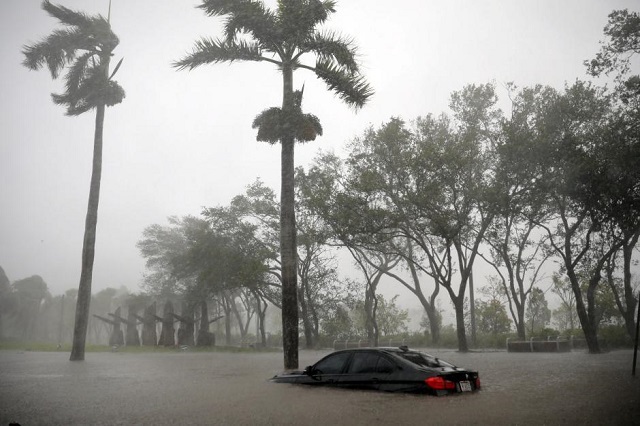 a partially submerged car is seen at a flooded area in coconut grove as hurricane irma arrives at south florida in miami florida us photo reuters